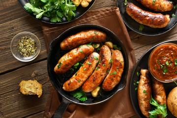 Fried sausages in frying pan