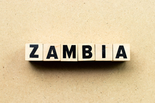 Alphabet letter block in word zambia on wood background