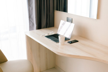 Cropped shot of an area preparing for work from home smart phone and notebook computer