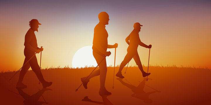 Concept de la randonnée avec un groupe de promeneur faisant de la marche nordique sur un chemin de campagne.