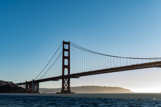 Famous Golden Gate Bridge in San Francisco California USA. The Golden Gate Bridge is a suspension bridge spanning the Golden Gate connecting San Francisco bay and pacific ocean © Bill