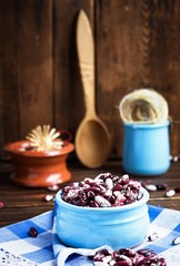 Violet with dots beans in ceramic bowl. Swallow beans. Vegetables for healthy eating. Organic food.