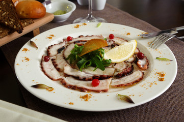 octopus salad with lemon and cranberries