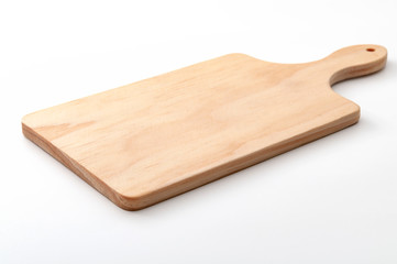 Food preparation tool and kitchen utensils concept with close-up on rectangular wood chopping board...