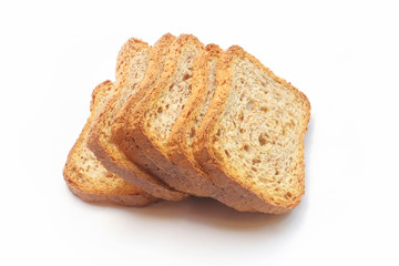 SLICES OF WHOLE GRAIN RUSK BREAD ON WHITE BACKGROUND