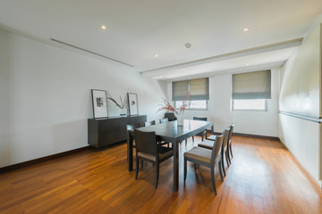 Stylish kitchen interior with dining table and chairs