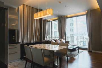 Stylish kitchen interior with dining table and chairs