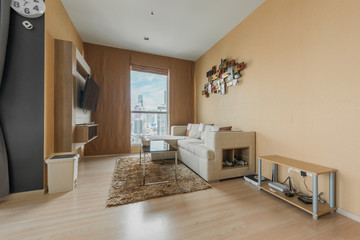 Beautiful and large living room interior with hardwood floors and vaulted ceiling in new luxury home.