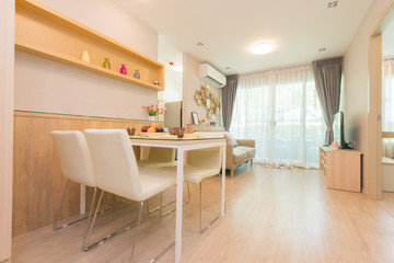 Stylish kitchen interior with dining table and chairs