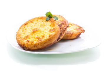 round bread croutons fried in batter in a plate