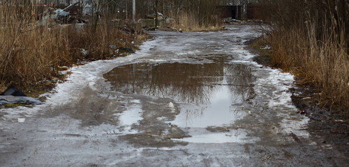 Puddle on a muddy rural road