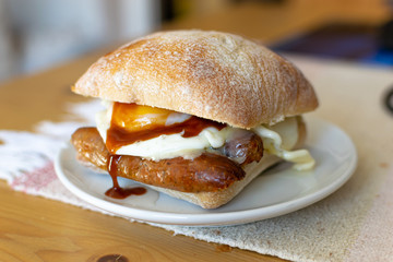Sausage and Egg Butty with Brown Sauce, a British staple.