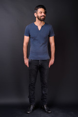 Obraz premium Full body shot of handsome bearded Persian man