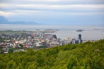 Fototapeta premium View over the cityscape of Bodo, Norway. Houses in the foreground & the sea & mountains in the background, Scandinavia. 