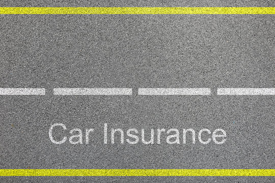 Top View Of Bitumen Road With Lanes And Car Insurance Sign