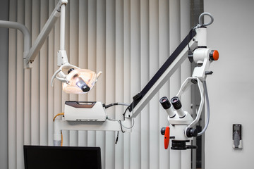 Dental microscope and lamp in the dentist's office