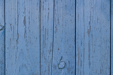old wooden wall texture with peeling blue paint