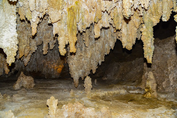 Calcite inlets, stalactites and stalagmites in large underground halls in Carlsbad Caverns National...