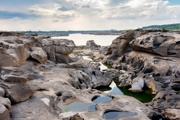 Thailand grand canyon (sam phan bok) at Ubon Ratchathani, Thailand. Beautiful landscape of holes and rock mountain with river.