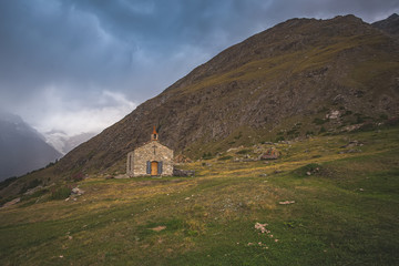 small old stone church high in the mountains in switzerland