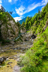 Fototapeta na wymiar Beautiful scenery of Stuibenfälle - River and waterfall at Reutte in mountain scenery of Alps, Austria