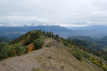 Fototapeta premium Beautiful mountain autumn views on the route from the Mt. Megruki peak to Atskuri. Borjomi-Kharagauli National Park, Borjomi, Georgia. 