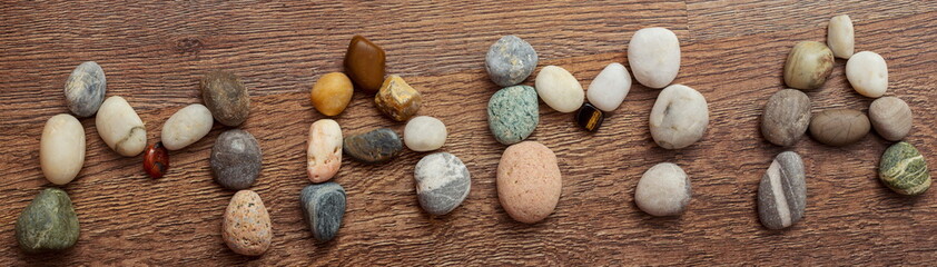 Fototapeta na wymiar The word mother in Russian is made up of various stones