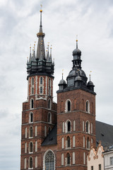 Fototapeta na wymiar Towers St Mary's Church at Market Square in Cracow, Poland