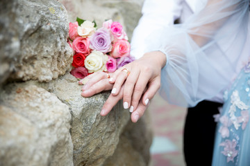 bride and groom holding hands