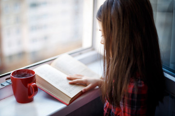 young woman reading a book