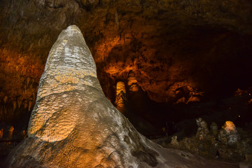 Calcite inlets, stalactites and stalagmites in large underground halls in Carlsbad Caverns National...