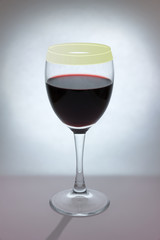 Glass of red wine on a defocused background. Selective focus