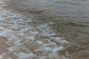 Sea waves with white foam