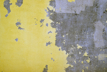 Part of the wrapped facade is yellow. Restoration of the wall. Construction work, quartz soil,...