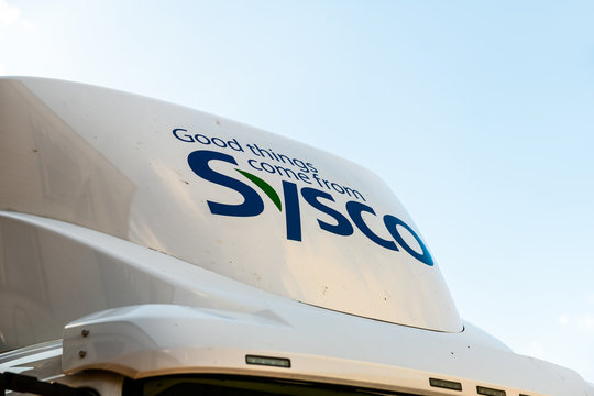 Hot Springs, USA - October 18, 2019: Virginia road street and closeup of Sysco truck with sign and logo message isolated against sky