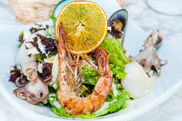Octopus shrimp squid seafood salad closeup shot in restaurant.
 
