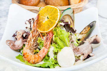 Octopus shrimp squid seafood salad closeup shot in restaurant.
 
