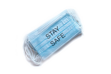 Medical mask STAY SAFE. Coronavirus COVID-19 pandemic. Medical protective masks isolated on white...
