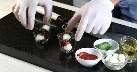 Chef preparing canapes in the kitchen at the restaurant 