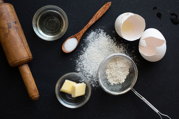 Ingredients to make pancake on wooden table