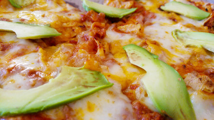 CU pizza with avocado topping.


