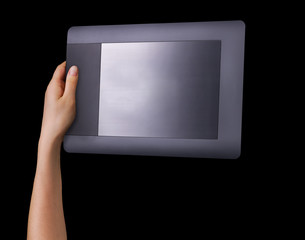 Hand holding graphic tablet for illustratorsand designers isolated on black