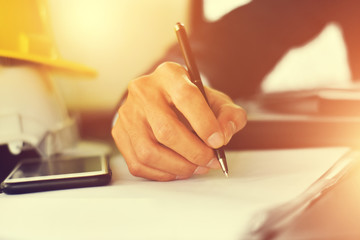 Close up Hand writing on  document or signature to contract business