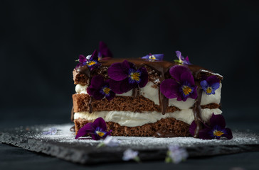 black forest chocolate cake with beautiful edible violet flowers