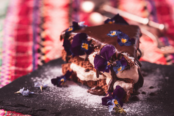black forest chocolate cake with beautiful edible violet flowers