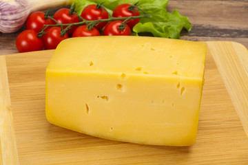 Hard yellow tasty cheese brick