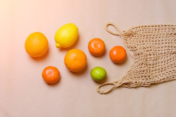 String bag with mixed citrus fruits. Zero waste concept.