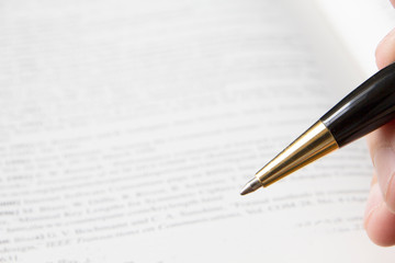 Student reading book for exam