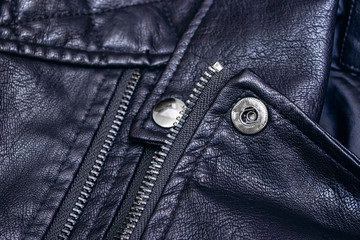 Zipper and rivets on black leather clothes