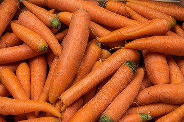 Fresh orange carrots as a background
